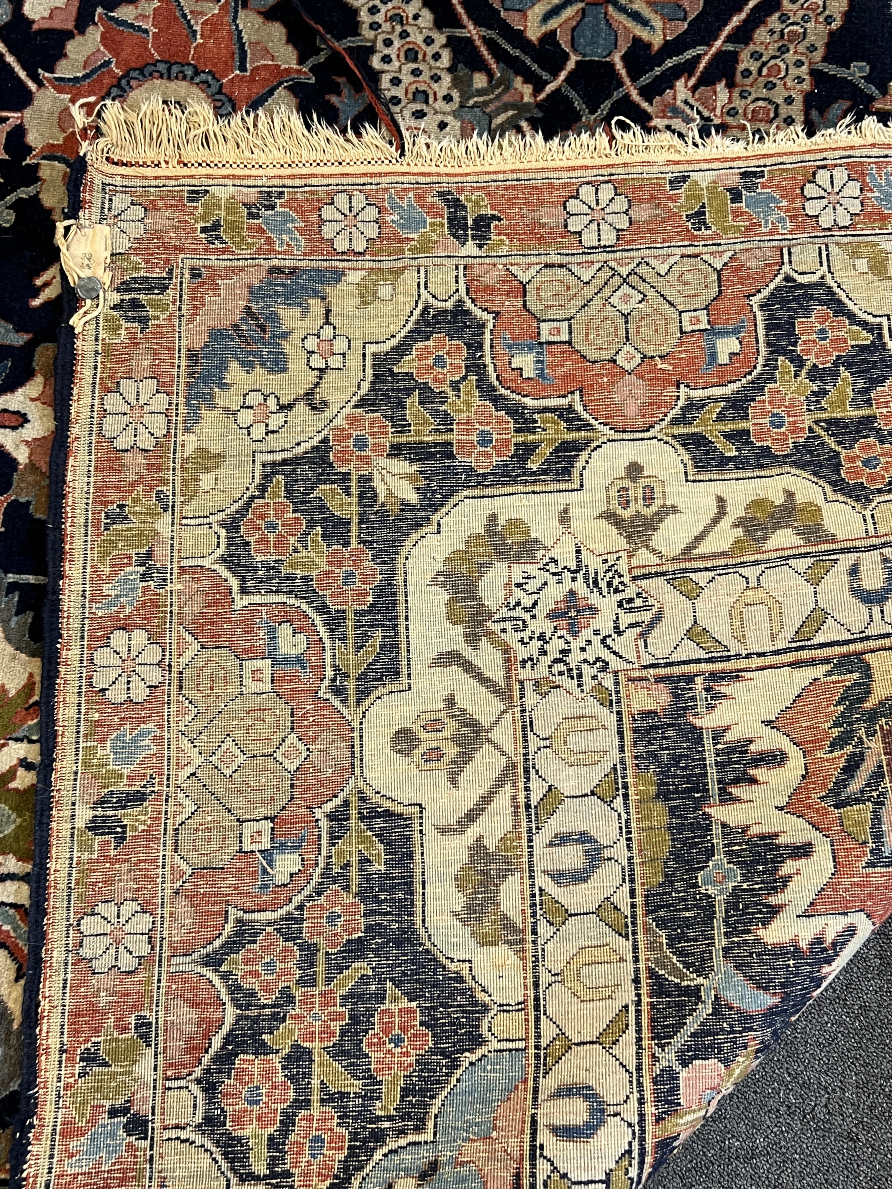 An early 20th century Benlian Tabriz carpet, signed Mahmud, 320 x 225cm